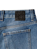 Jeans acampanados de tiro medio color blanco roto