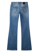 Jeans acampanados de tiro medio color blanco roto