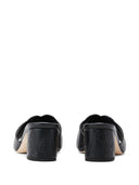 Mules de cuero con sello de Alexander McQueen