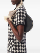 Мини-сумка-хобо Valentino Garavani Rockstud из зернистой телячьей кожи