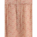 Blusa con estampado de follaje y cuello alto refinado